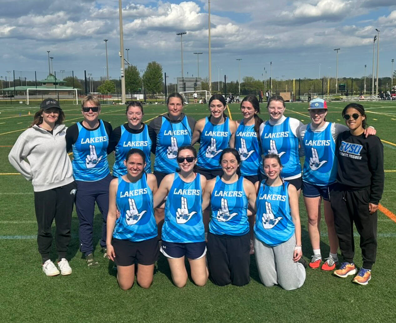 women college ultimate team smiling together